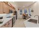 Bright open kitchen with stainless steel appliances, breakfast nook, and neutral countertops at 15221 N Clubgate Dr # 1138, Scottsdale, AZ 85254