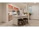 Bright kitchen with stainless steel appliances, breakfast bar with seating, and neutral countertops at 15221 N Clubgate Dr # 1138, Scottsdale, AZ 85254