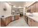 A modern kitchen with stainless steel appliances, countertops, and light wood cabinets at 15221 N Clubgate Dr # 1138, Scottsdale, AZ 85254