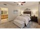 Comfortable bedroom with ceiling fan, carpet flooring, and an ensuite bathroom for added convenience and privacy at 15221 N Clubgate Dr # 1138, Scottsdale, AZ 85254