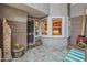 Inviting private patio with tiled floor, security screen door, and large window at 15221 N Clubgate Dr # 1138, Scottsdale, AZ 85254