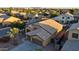 This is an aerial view of a two-story home in a residential neighborhood with mountain views at 1619 E Beretta Pl, Chandler, AZ 85286