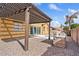 The backyard features a covered patio, outdoor kitchen, and a sparkling pool perfect for entertaining at 1619 E Beretta Pl, Chandler, AZ 85286