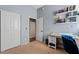 This is a bedroom with shelving and a small desk at 1619 E Beretta Pl, Chandler, AZ 85286