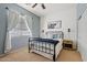 Inviting bedroom with a shiplap accent wall and natural light at 1619 E Beretta Pl, Chandler, AZ 85286