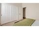 Cozy bedroom features ample closet space and a neutral color palette at 1619 E Beretta Pl, Chandler, AZ 85286