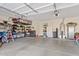 Organized garage with ample storage space, shelving units, and a clean, finished floor at 1619 E Beretta Pl, Chandler, AZ 85286