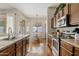 Well-equipped kitchen with stainless steel appliances and hardwood floors at 1619 E Beretta Pl, Chandler, AZ 85286