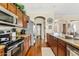 Spacious kitchen with stainless steel appliances and warm wood cabinetry at 1619 E Beretta Pl, Chandler, AZ 85286