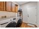 Bright laundry room features stainless steel washer and dryer units at 1619 E Beretta Pl, Chandler, AZ 85286