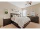 Comfortable main bedroom with a plush bed, matching nightstands, and ample natural light at 1619 E Beretta Pl, Chandler, AZ 85286