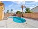 Backyard featuring a sparkling pool, surrounded by mature landscaping and a brick privacy fence at 1619 E Beretta Pl, Chandler, AZ 85286