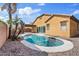 Private backyard with a refreshing pool, desert landscaping, and a covered patio for outdoor relaxation at 1619 E Beretta Pl, Chandler, AZ 85286