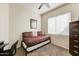 Bedroom featuring day bed, carpet, and a view to the exterior at 1635 W Owens Way, Anthem, AZ 85086