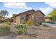 Charming single-story home boasts desert landscaping, stone accents, and an attached two-car garage at 1635 W Owens Way, Anthem, AZ 85086