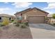 Welcoming single-Gathering home with a neutral color palette, stone accents, and a spacious two-car garage at 1635 W Owens Way, Anthem, AZ 85086