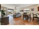 Bright living room boasts wood floors, neutral walls, and sliding glass doors leading to the patio at 1635 W Owens Way, Anthem, AZ 85086