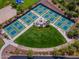 Aerial view of the community's multiple outdoor tennis courts surrounded by greenery and seating area at 1635 W Owens Way, Anthem, AZ 85086