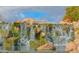 Beautiful stone waterfall and water feature enhancing the natural landscape and neighborhood appeal at 1635 W Owens Way, Anthem, AZ 85086