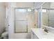 Full bathroom featuring a shower/tub combo with sliding glass doors, toilet, and vanity with sink at 16848 W Bradford Way, Surprise, AZ 85374