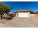 Charming single-Gathering home featuring a tile roof and a two-car garage on a sunny day at 16848 W Bradford Way, Surprise, AZ 85374