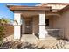 A cozy front porch features an archway, a security door and a small gated front patio at 16848 W Bradford Way, Surprise, AZ 85374