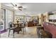Cozy dining area featuring a round table, comfortable seating, and modern light fixture at 17675 N Coconino Dr, Surprise, AZ 85374