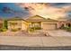 Charming single-story home with desert landscaping and a two-car garage at 17675 N Coconino Dr, Surprise, AZ 85374