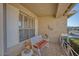 Cozy front porch seating area with decorative touches and natural light at 17675 N Coconino Dr, Surprise, AZ 85374