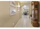 Hallway with tile flooring and decorative accents including a grandfather clock at 17675 N Coconino Dr, Surprise, AZ 85374
