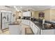 Modern kitchen with stainless steel appliances, granite countertops, and a central island at 17675 N Coconino Dr, Surprise, AZ 85374