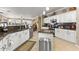 Beautiful kitchen featuring stainless appliances, an island, and custom white cabinetry at 17675 N Coconino Dr, Surprise, AZ 85374