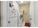 Laundry room with washer, dryer, and ample storage space, plus a utility sink at 17675 N Coconino Dr, Surprise, AZ 85374
