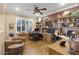 Inviting home office with custom built-ins, wood floors, and natural light at 17675 N Coconino Dr, Surprise, AZ 85374