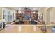 Large home office featuring custom built-in shelving and lots of workspace at 17675 N Coconino Dr, Surprise, AZ 85374