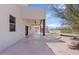 Expansive covered back patio with ceiling fans overlooking the pool and desert landscaping at 18344 W Santa Irene Dr, Goodyear, AZ 85338
