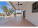 Large covered back patio with ceiling fans and access to the pool at 18344 W Santa Irene Dr, Goodyear, AZ 85338