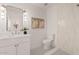 Bright bathroom featuring a neutral color palette, decorative mirror and patterned floor tile at 18344 W Santa Irene Dr, Goodyear, AZ 85338