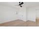 A modern bedroom with wood floors and minimalist decoration at 18344 W Santa Irene Dr, Goodyear, AZ 85338