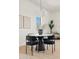 Cozy dining area featuring modern lighting, stylish furniture, and minimalist decor at 18344 W Santa Irene Dr, Goodyear, AZ 85338