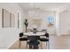 Bright dining room with a modern table, stylish chairs, and contemporary decor at 18344 W Santa Irene Dr, Goodyear, AZ 85338