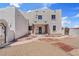 Inviting Southwestern-style home showcasing a decorative walkway and covered entryway at 18344 W Santa Irene Dr, Goodyear, AZ 85338