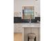 Kitchen featuring counter with a deep sink and center island, with natural light streaming through the window at 18344 W Santa Irene Dr, Goodyear, AZ 85338