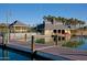 Lakeside community building with docks, boat rentals, and palm tree views, offering recreational water activities at 18344 W Santa Irene Dr, Goodyear, AZ 85338