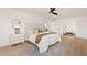 A cozy bedroom with neutral colors, a bed and carpet that complement the interior decor at 18344 W Santa Irene Dr, Goodyear, AZ 85338