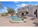 Backyard features a unique pool design, beautiful landscaping and a view of the home at 18344 W Santa Irene Dr, Goodyear, AZ 85338