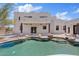 Backyard features a unique pool design, beautiful landscaping and a view of the home at 18344 W Santa Irene Dr, Goodyear, AZ 85338