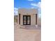 Charming pool house with double doors and stone pathway at 18344 W Santa Irene Dr, Goodyear, AZ 85338