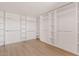 An organized walk-in closet with ample shelving and hanging space for clothing and accessories at 18344 W Santa Irene Dr, Goodyear, AZ 85338