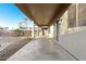 Extended back patio with sliding glass doors leading to the interior of the home, overlooking the backyard at 22500 N Greenland Park Dr, Maricopa, AZ 85139